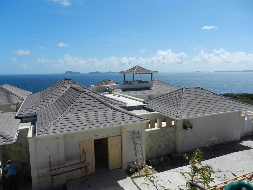 Beautiful home featuring an Enviroshake roof with coastal mountain skyline in background