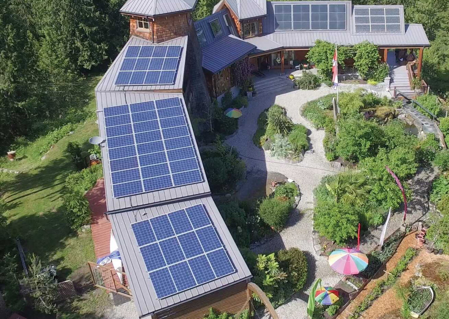 arial view of large home with solar panels on top