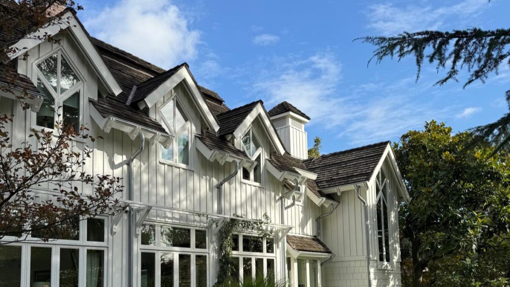 white gabled house with metal roof